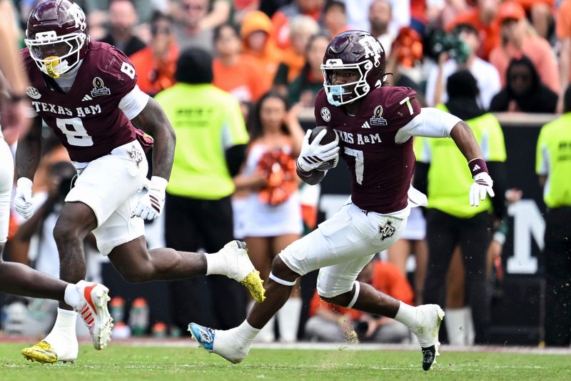 Dec 20, 2025; College Station, TX, USA; Texas A&M Aggies wide receiver KC Concepcion (7) runs the ball against the Miami Hurricanes during the second half at Kyle Field. Mandatory Credit: Maria Lysaker-Imagn Images