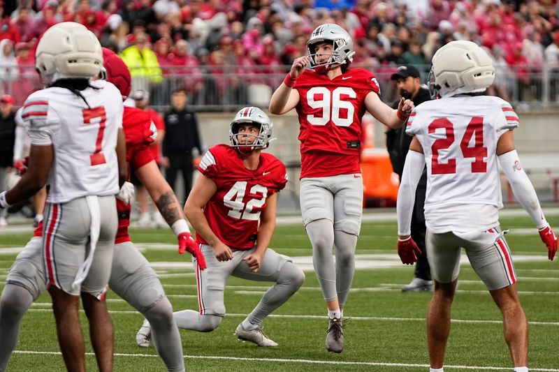 Kicker Connor Hawkins (96) kicks a point after during the Ohio State football spring game at Ohio Stadium in Columbus on April 18, 2026.