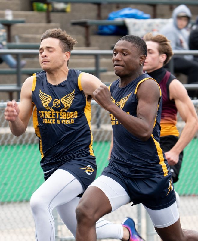 Streetsboro’s Isiah Henderson, right, and Noah Hodge compete in the 100-meter dash at the Mogadore Wildcat Invitational.