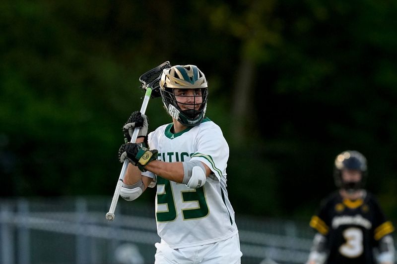 Dublin Jerome's Deangelo Nardone (33) passes the ball in the first half of the OHSAA lacrosse game at Dublin Jerome High School on Thursday, April 30, 2026 in Dublin, Ohio.