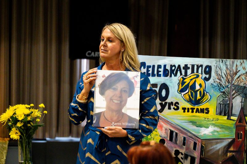Breonna Haer listens as Canal Fulton Mayor Joseph Schultz delivers a proclamation to the Sts. Philip & James School community during the 150th birthday celebration. May 1, 2026