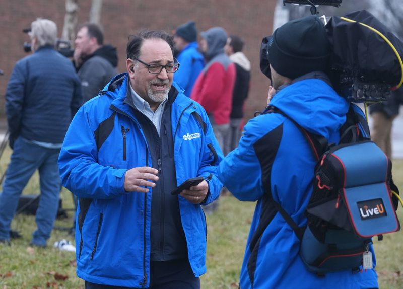 In an empty lot in downtown New Albany, Ohio, WSYX reporter Tom Bosco covers a news conference after US House Democrats deposed Ohio retail mogul Les Wexner Wednesday, Feb. 18, 2026 about his former financial adviser and accused child sex trafficker Jeffrey Epstein. Wexner was originally ordered to appear before the committee in a closed-door meeting in Washington, D.C., according to a subpoena. But the location of the deposition was changed to Wexner's estate in New Albany, Ohio.
