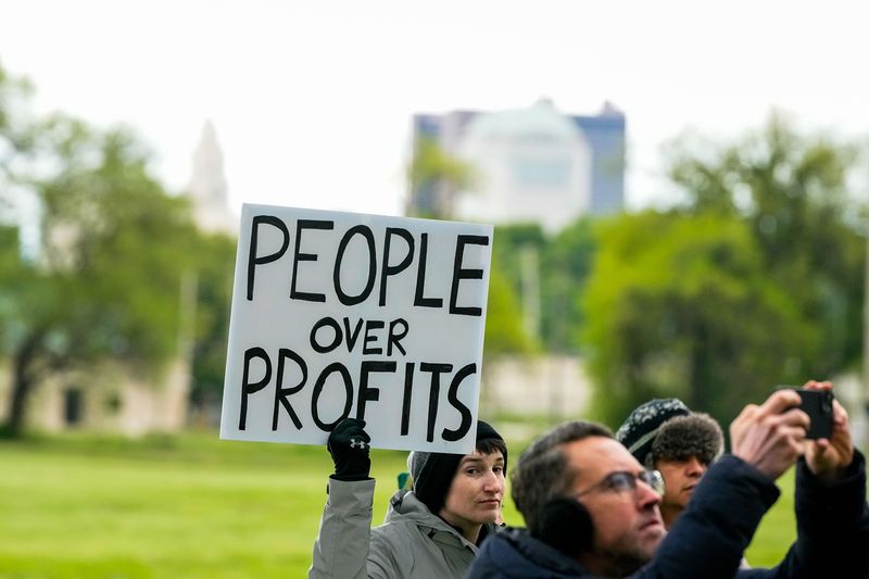 “People over profits” sign at the "Hands off McCoy Park" rally at McCoy Park on Friday, May 1, 2026 in Columbus, Ohio.