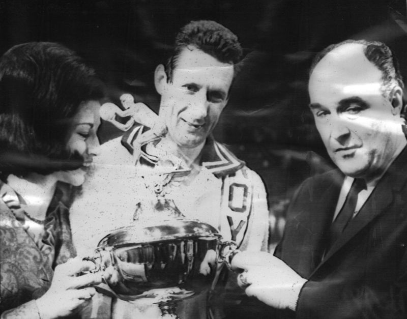 National Basketball commissioner Walter Kennedy, right, presents the most valuable player trophy to Adrian Smith of the Cincinnati Royals following the Jan. 11, 1966, NBA All-Star game at Cincinnati Gardens. Smith scored 24 points for the East team to win the trophy.