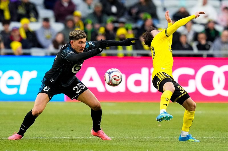 Columbus Crew midfielder Hugo Picard (30) reacts after getting hit in the face by Minnesota United FC defender Nectarios Triantis (25) in the first half of the MLS match at ScottsMiracle-Gro Field on Saturday, May 2, 2026 in Columbus, Ohio.