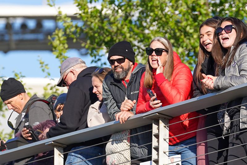Supporters cheer for runners during the 2026 Flying Pig Marathon, Sunday, May 3, 2026, in downtown Cincinnati.
