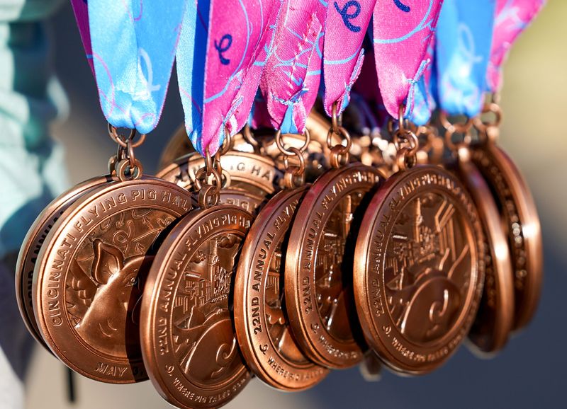Medals are passed out to runners during the 2026 Flying Pig Marathon, Sunday, May 3, 2026, in downtown Cincinnati.