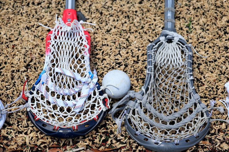 Lacrosse sticks are shown on the Air Force Falcons sideline during the second quarter of the ASUN Men’s Lacrosse Championship at Rock Stadium, Sunday, May 3, 2026, in Jacksonville, Fla. [Corey Perrine/Florida Times-Union]