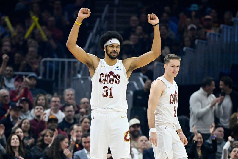 Apr 8, 2026; Cleveland, Ohio, USA; Cleveland Cavaliers center Jarrett Allen (31) celebrates beside guard Sam Merrill (5) in the third quarter against the Atlanta Hawks at Rocket Arena. Mandatory Credit: David Richard-Imagn Images