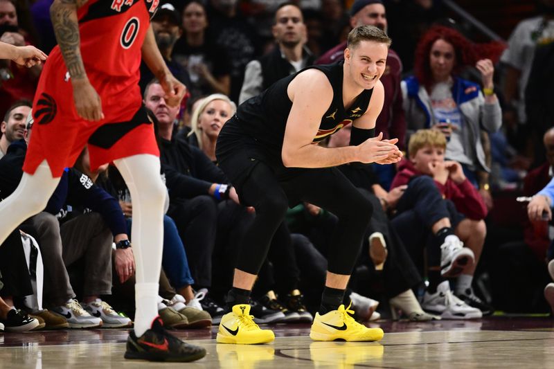 May 3, 2026; Cleveland, Ohio, USA; Cleveland Cavaliers guard Sam Merrill (5) reacts after a play against the Toronto Raptors during the second half of game seven in the first round of the 2026 NBA Playoffs at Rocket Arena. Mandatory Credit: Ken Blaze-Imagn Images