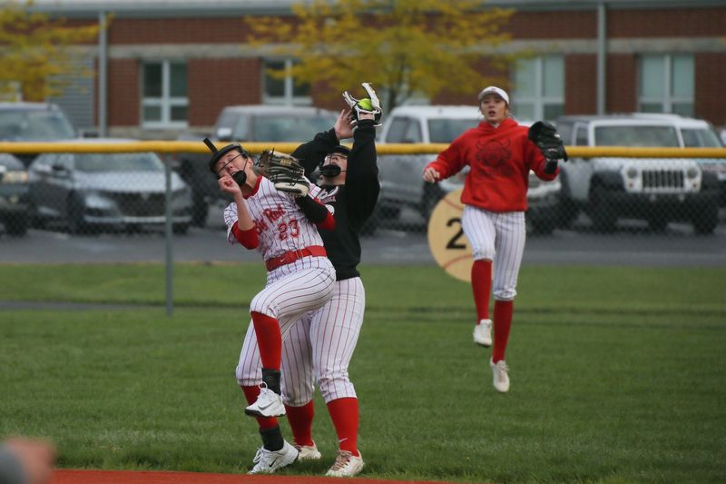 Plymouth's Malyah Laroux makes the catch behind Kristi Yeager with Presley Martin looking on during the Big Red's 15-11 nonconference softball win over Buckeye Central on Friday, May 1, 2026.
