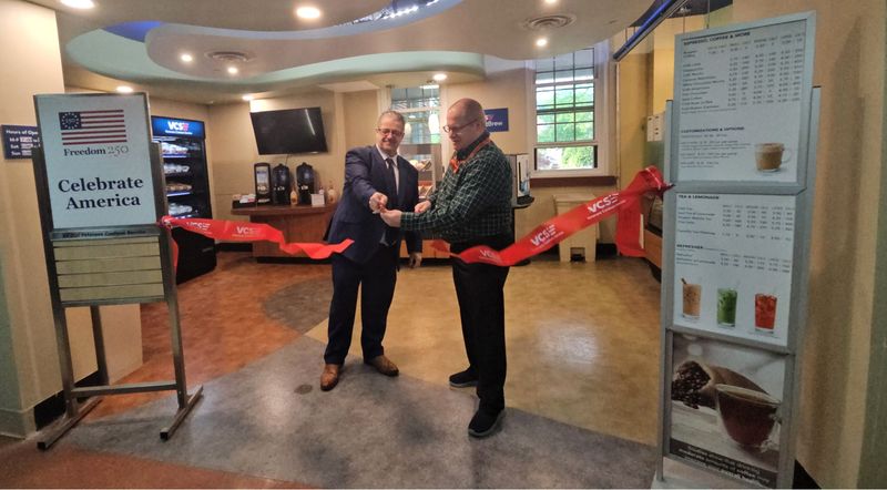 Regional Director of Veterans Canteen Service Mark Sciuchetti and Medical Center Director Ken Mortimer cut the ribbon to open the Chillicothe VA's new cafe, PatriotBrew.