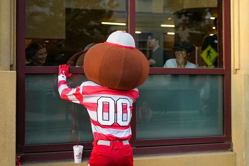 Brutus Buckeye interacts with students in the academic builds alongside the homecoming parade route on Oct. 3, 2025.