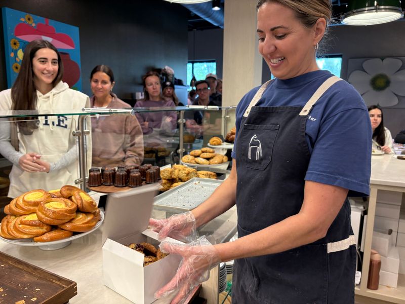 Darcie Bosshard boxes pastries for a customer at Morning Star Bakery & Cafe in Bath.