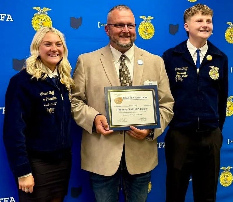 Ed Huff, with his children, Alaena and Jaxon, recently received honorary state FFA degree for his work at Ridgewood Local Schools.