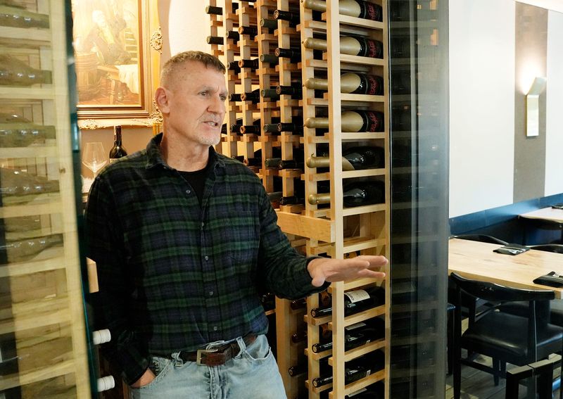 Michael Bruno, owner of the Blue Door Cafe & Bakery, talks about converting a storage space into a wine room at the Cuyahoga Falls restaurant May 1, 2026.