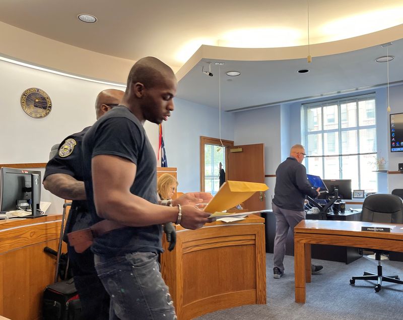 Xavier Jackson is led into the courtroom for his bench trial on May 4, 2026.