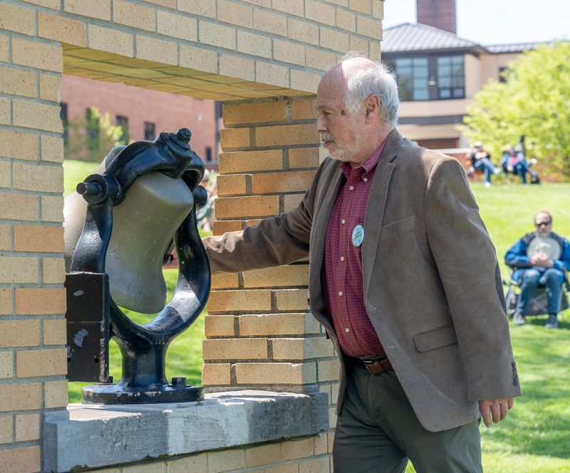 Russ Miller, brother of Jeffrey Miller, who was killed in the shooting, rings the Victory Bell at the Kent State May 4 commemoration in Kent on May 4, 2026.