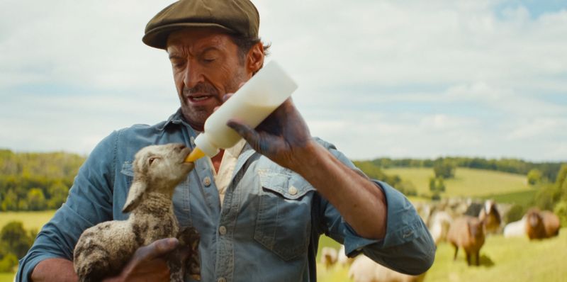Left to right: Tommy Birchall as the voice of The Winter Lamb and Hugh Jackman as George Hardy in "The Sheep Detectives."