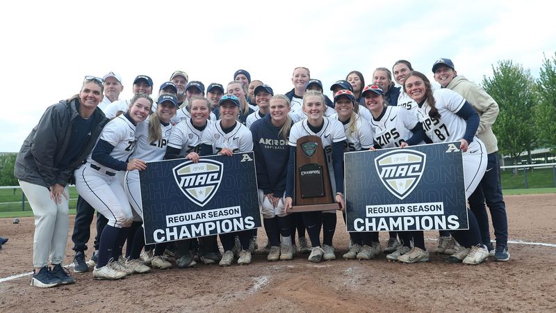 The Akron Zips softball team poses with the Mid-American Conference regular-season championship trophy on May 2, 2026.