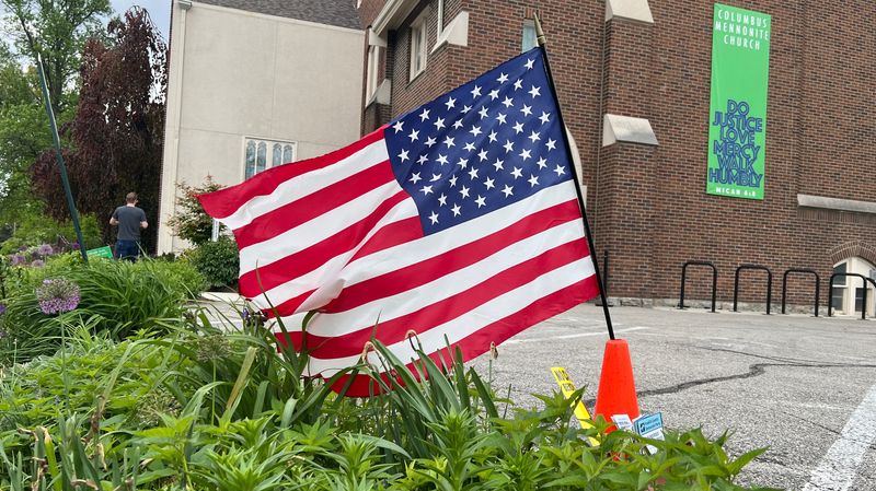 A flag waves near the polling place at the Columbus Mennonite Church in the Clintonville neighborhood of Columbus on May 5, 2026.
