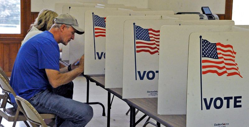 Voters at the May 5 primary at St. Peter Parish in Millersburg use paper ballots.