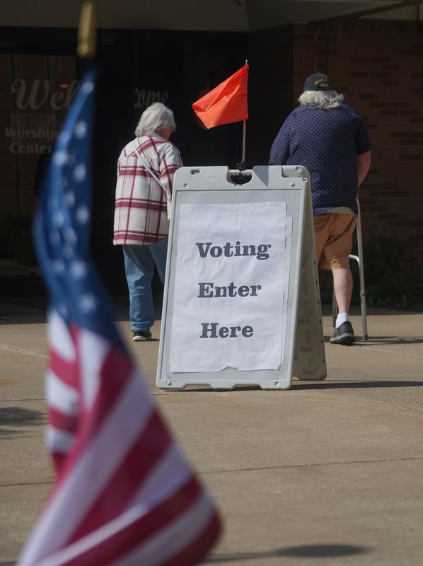 A couple enters Perry Christian Church at 139 Perry Dr. NW in Perry Township to vote on May 5. The polling location was one of many in the 6th Congressional District, which includes much of Stark County, six counties and parts of three other counties.
