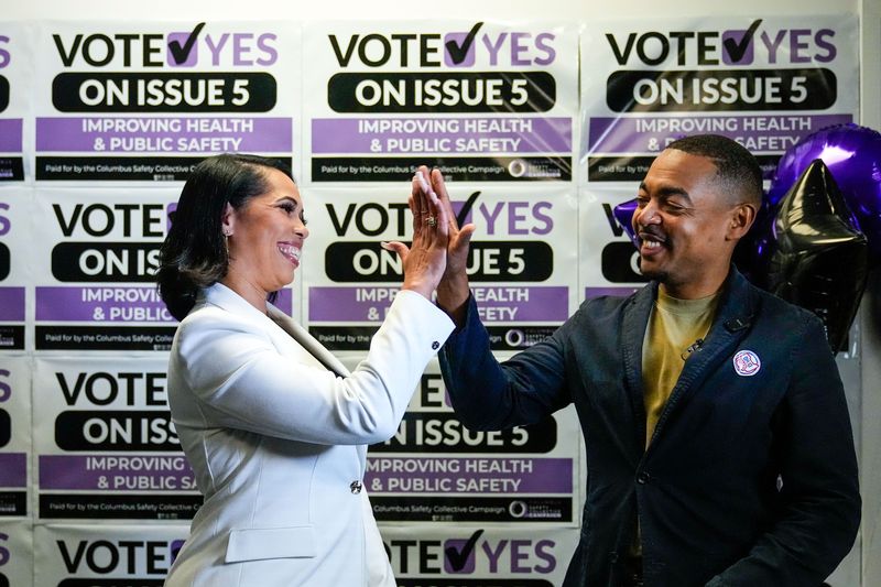 Chana Wiley, co-chair of the Columbus Safety Collective, high-fives Columbus City Council President Shannon Hardin during a primary election night party at the ACLU of Ohio office on Tuesday, May 5, 2026 in Columbus, Ohio.
