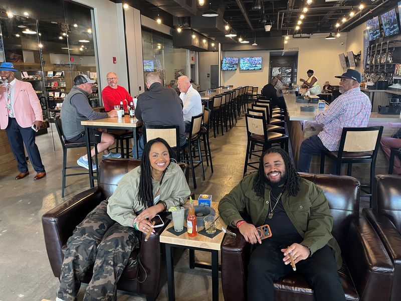 Eric Barber, 36, and his wife, Breana, 35, enjoy their cigars at Cigars International Superstore in Newport, Kentucky. The couple said they enjoy the cigar lounge experience as an alternative to the traditional nightclub scene.
