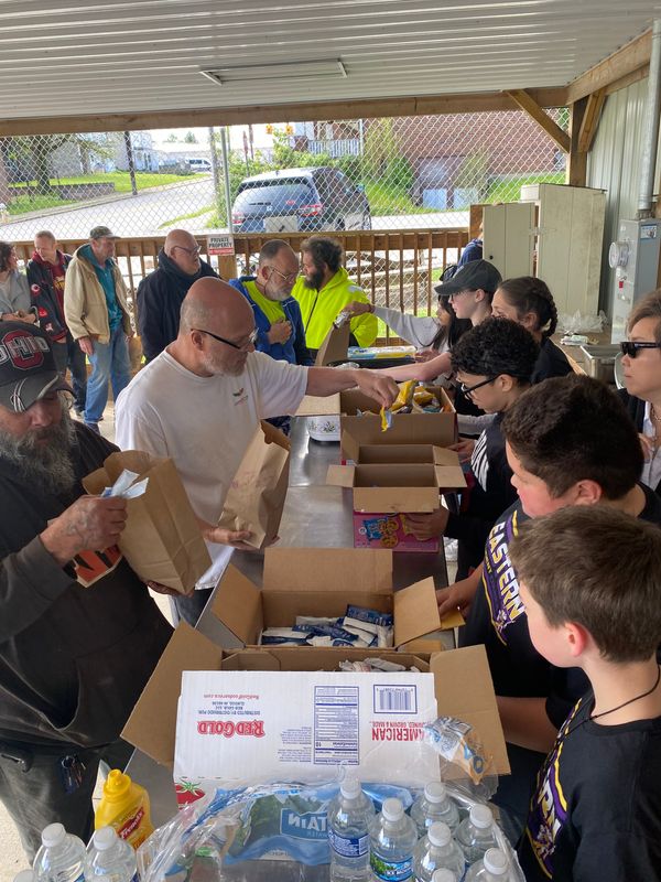 Sixth graders from Eastern Elementary Student Council Wednesday, May 6, brought food for 100 people and served the food at the pavilion at 73 Bowman St.