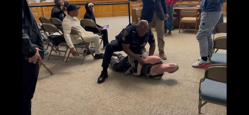 A woman is arrested May 6 at a Cincinnati City Council meeting.