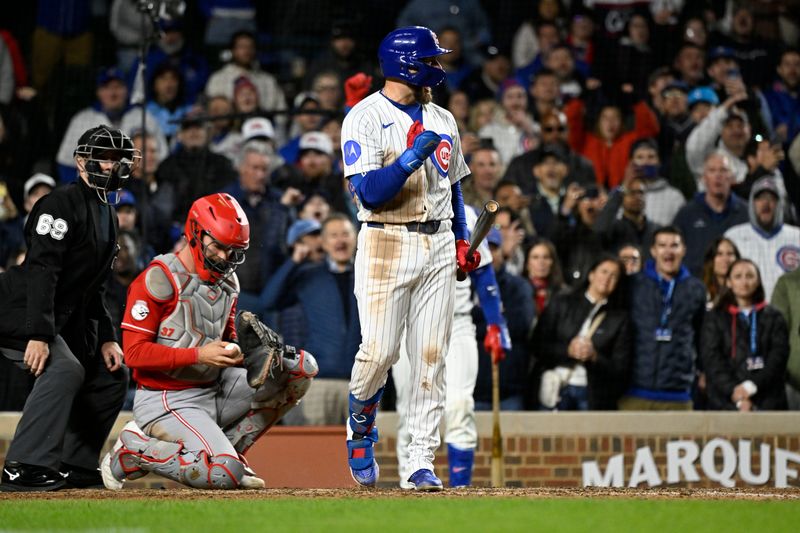 Chicago Cubs first baseman Michael Busch pumps his fist after being walked during the tenth inning against the Cincinnati Reds at Wrigley Field.