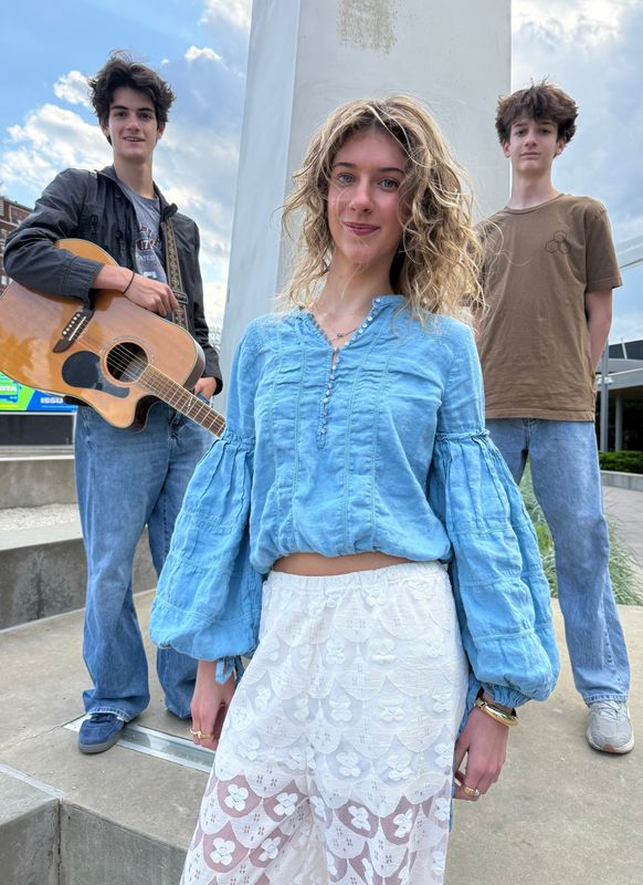 COMPASS, a pop rock teen band from Jackson Township, pose for a photo at Centennial Plaza in downtown Canton. From left are Harrison, Arianna and John Kefalas. The band will perform on May 21 at The Auricle with an ensemble from the Canton Symphony Orchestra.
