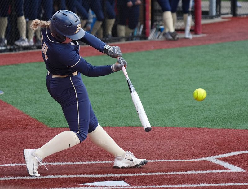 University of Akron’s Katie Cantrell hits a double against Ohio University in the first inning of a MAC Tournament game at Firestone Stadium in Akron on May 7, 2026.