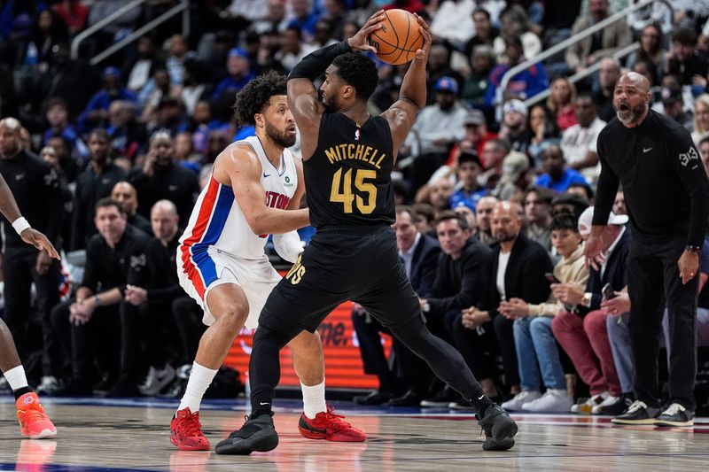 Detroit Pistons guard Cade Cunningham (2) defends Cleveland Cavaliers guard Donovan Mitchell (45) during the first half of Game 2 of second round of NBA playoffs at Little Caesars Arena in Detroit on Thursday, May 7, 2026.