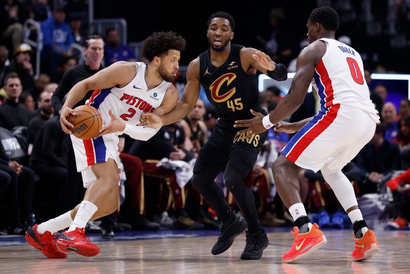 Detroit Pistons guard Cade Cunningham (2) dribbles past Cleveland Cavaliers guard Donovan Mitchell (45) during Game 2 of a second-round NBA playoff series May 7, 2026, in Detroit.