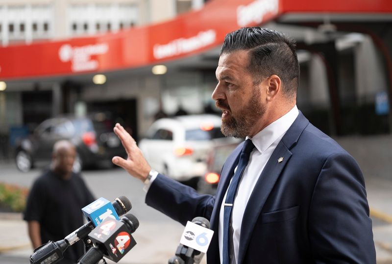 Brian Steel speaks July 7, 2023 outside of OhioHealth Grant Medical Center the day after a Columbus police officer was critically injured and one of three suspects in an armed robbery spree was fatally shot during an exchange of gunfire on Interstate 70 east near West Mound Street.