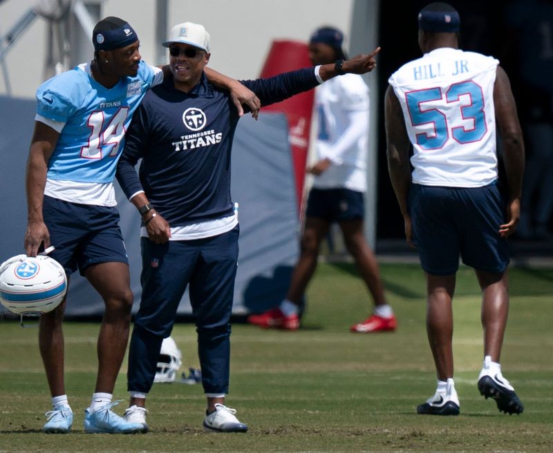 Tennessee Titans wide receiver Carnell Tate (14) talks with defensive pass game coordinator/cornerbacks coach Tony Oden during the Titans Rookie Camp Day 2 at Vanderbilt Health Football Center in Nashville, Tenn., Saturday, May 2, 2026.