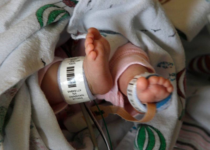 A baby born prematurely sleeps in a crib at the Newborn Intensive Care Unit at Children's Hospital in 2011. A report from Cradle Cincinnati found the infant mortality rate in Hamilton County jumped from 5.5 to 9.3 deaths per 1,000 births from 2023 to 2025.
