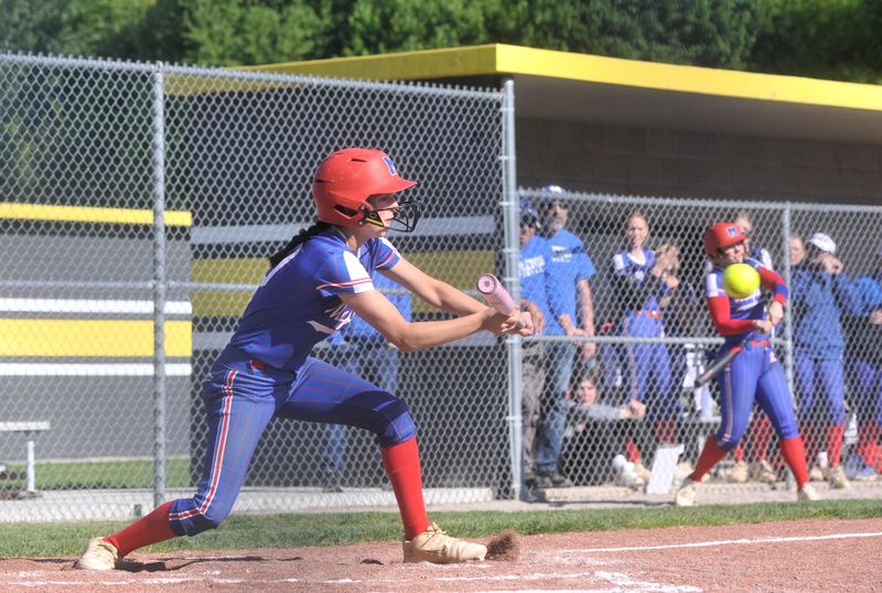 Mapleton's Kendall Ramey tries to lay down a bunt against Monroeville. The Eagles handed the Mounties their first loss in Firelands Conference play on May 11, 2026.