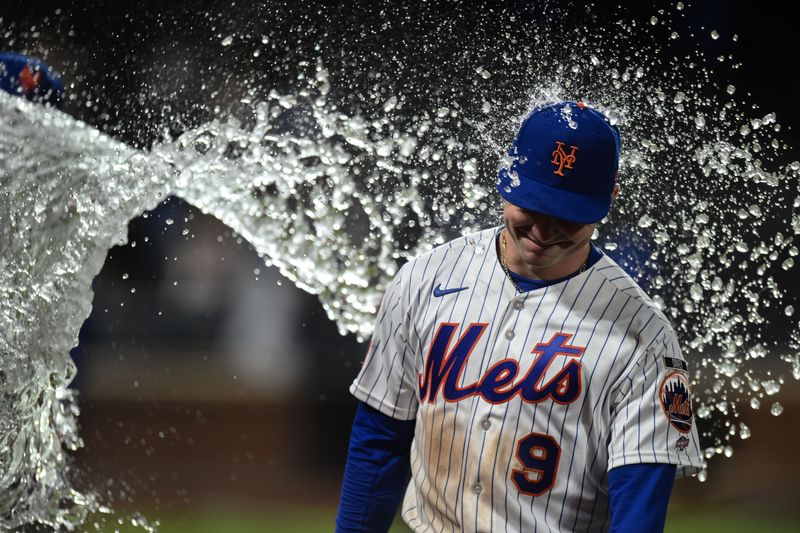 New York Mets outfielder A.J. Ewing (9) is doused with ice water after his major league debut against the Detroit Tigers on May 12, 2026, at Citi Field. Ewing starred with a triple, two RBIs, two runs scored, a stolen base and three walks.