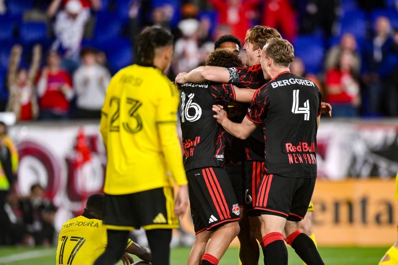 New York Red Bulls forward Julian Hall (16) celebrates with teammates after scoring his third goal of the game against the Crew.