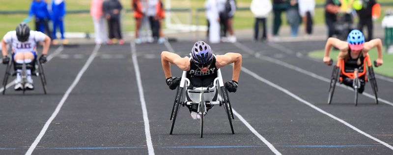 Lake's Darrah Rennick (left), Perry's Christopher Good (middle) and Ahsha DiPietro compete in the seated 100 meters during the Federal League Championships, Wednesday, May 13, 2026, at GlenOak High School.