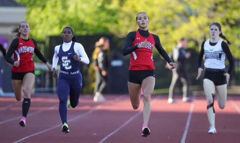 Wadsworth’s Hailey Otradovec, center, leads the group down the homestretch of the girls 400 meter dash during the Suburban League National Conference track and field meet, May 14, 2026, in North Royalton, Ohio.