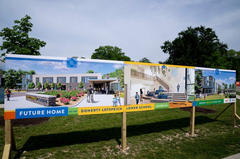Seven Hills School promotes its under-construction Doherty Lotspeich Lower School project on a campus billboard.