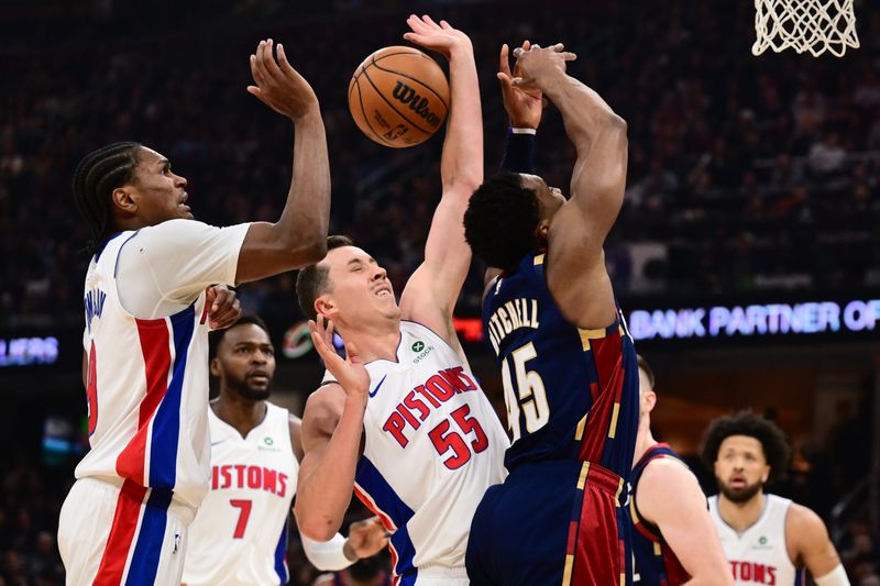 May 15, 2026; Cleveland, Ohio, USA; Detroit Pistons forward Duncan Robinson (55) knocks the ball away from Cleveland Cavaliers guard Donovan Mitchell (45) during the first half in game six of the second round of the 2026 NBA Playoffs at Rocket Arena. Mandatory Credit: Ken Blaze-Imagn Images