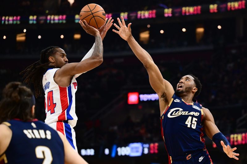 May 15, 2026; Cleveland, Ohio, USA; Detroit Pistons guard Daniss Jenkins (24) shoots over the defense of Cleveland Cavaliers guard Donovan Mitchell (45) during the second half in game six of the second round of the 2026 NBA Playoffs at Rocket Arena. Mandatory Credit: Ken Blaze-Imagn Images