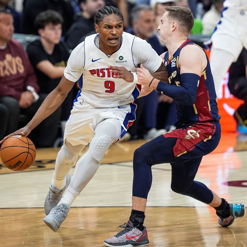 Detroit Pistons guard Ausar Thompson dribbles against Cavaliers guard Sam Merrill during the first half in Game 6 of a second-round playoff series, May 15, 2026, in Cleveland.