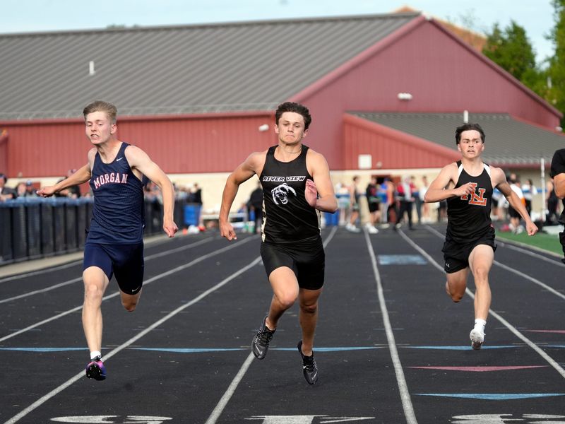 River View's Parker Andrews and Morgan's Braylon Miller, left, sprint toward the finish line in the 100 meters during the Muskingum Valley League track and field meet on Friday, May 15, 2026, at the Maysville Athletic Complex in Newton Township, Ohio.