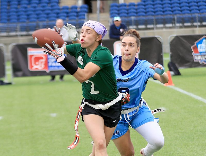 Nordonia's Ava McLendon, left, pulls in a pass on her way to a touchdown while being defended by Mount Notre Dame's Payton Reisert, right, in the inaugural girls flag football final held at Tom Benson Stadium Sunday afternoon, May 16, 2026.